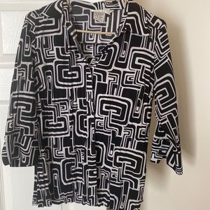 Black and white stylish blouse in great condition.